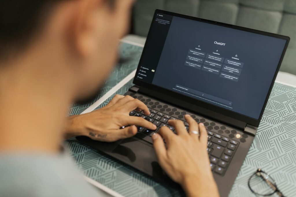 man with chatgpt in laptop